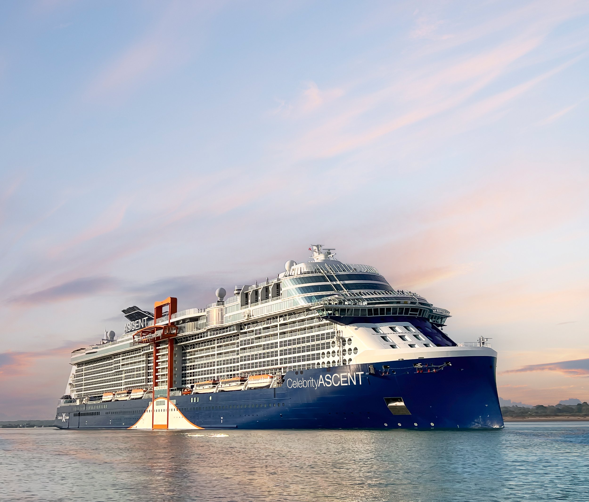 Celebrity Ascent cruise ship anchored in calm blue waters