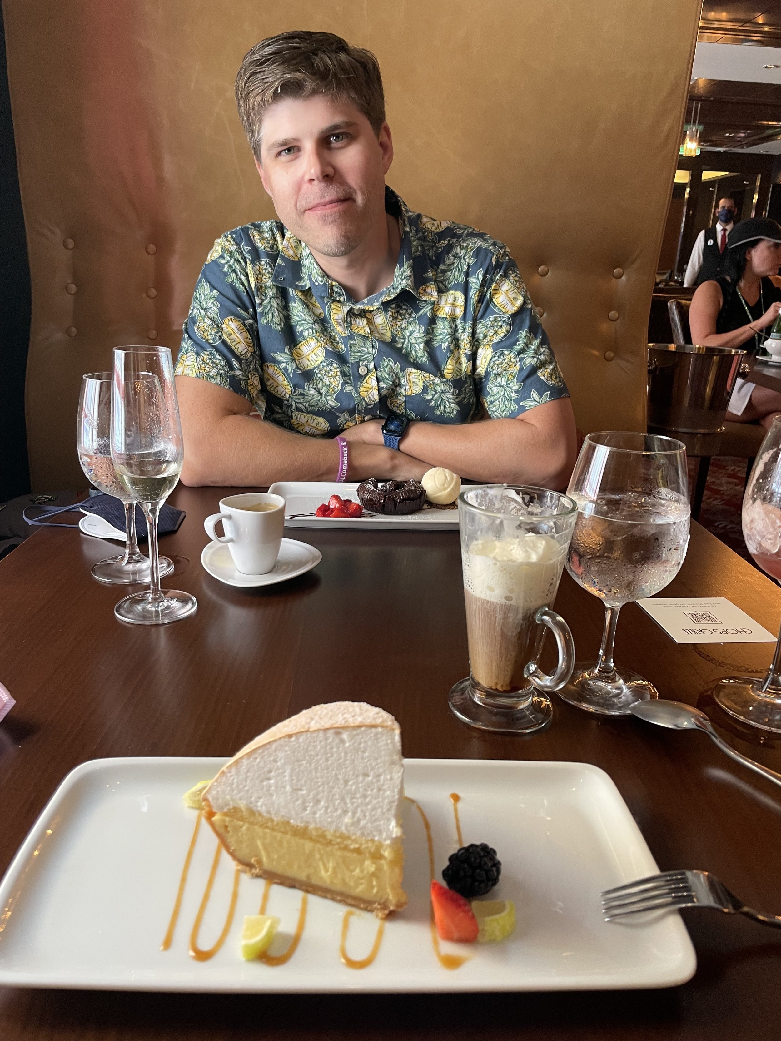Man dining at elegant restaurant with cheesecake dessert