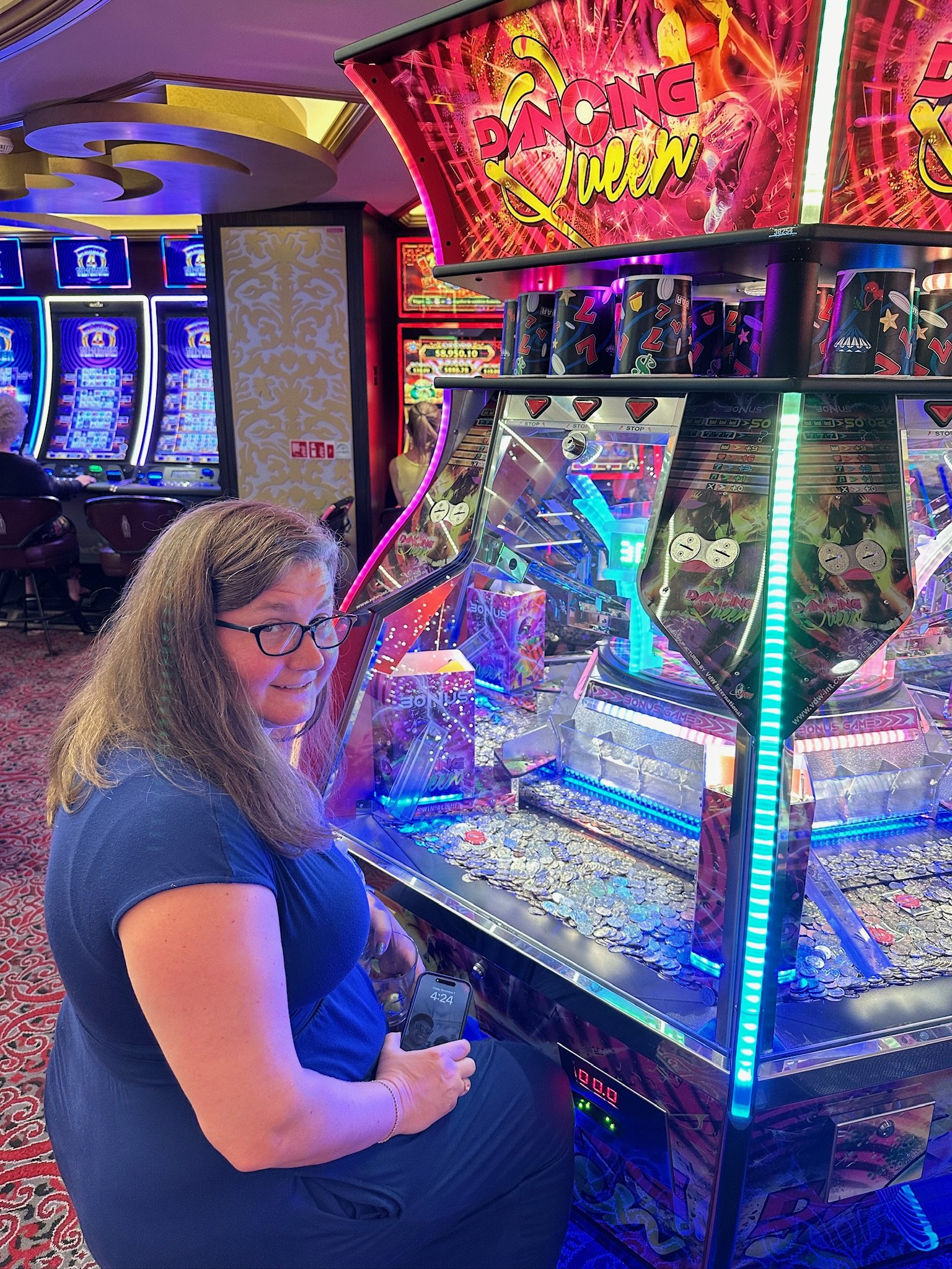 Woman playing Dancing Queen arcade game in casino