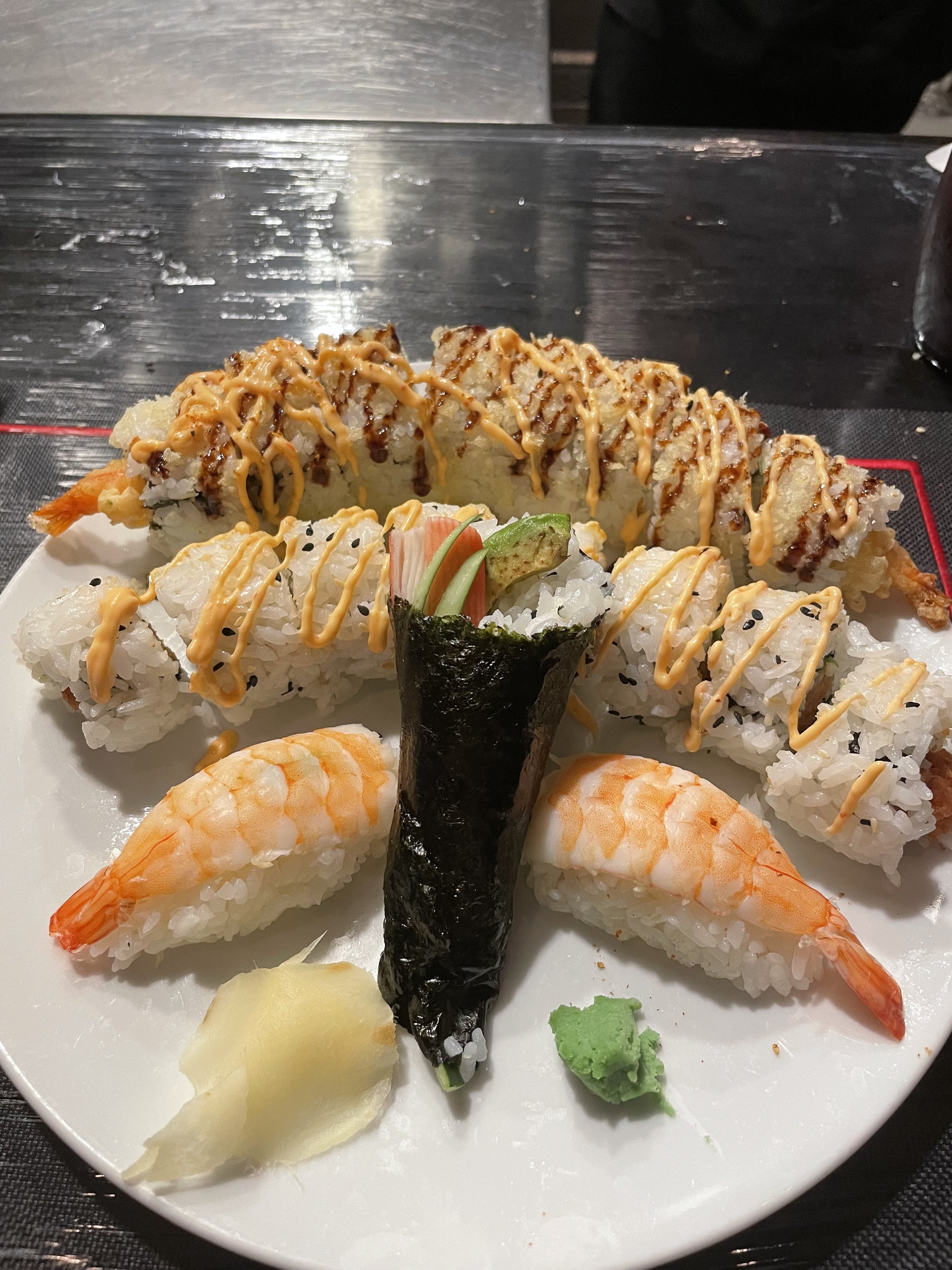 Assorted sushi platter with shrimp nigiri and specialty rolls
