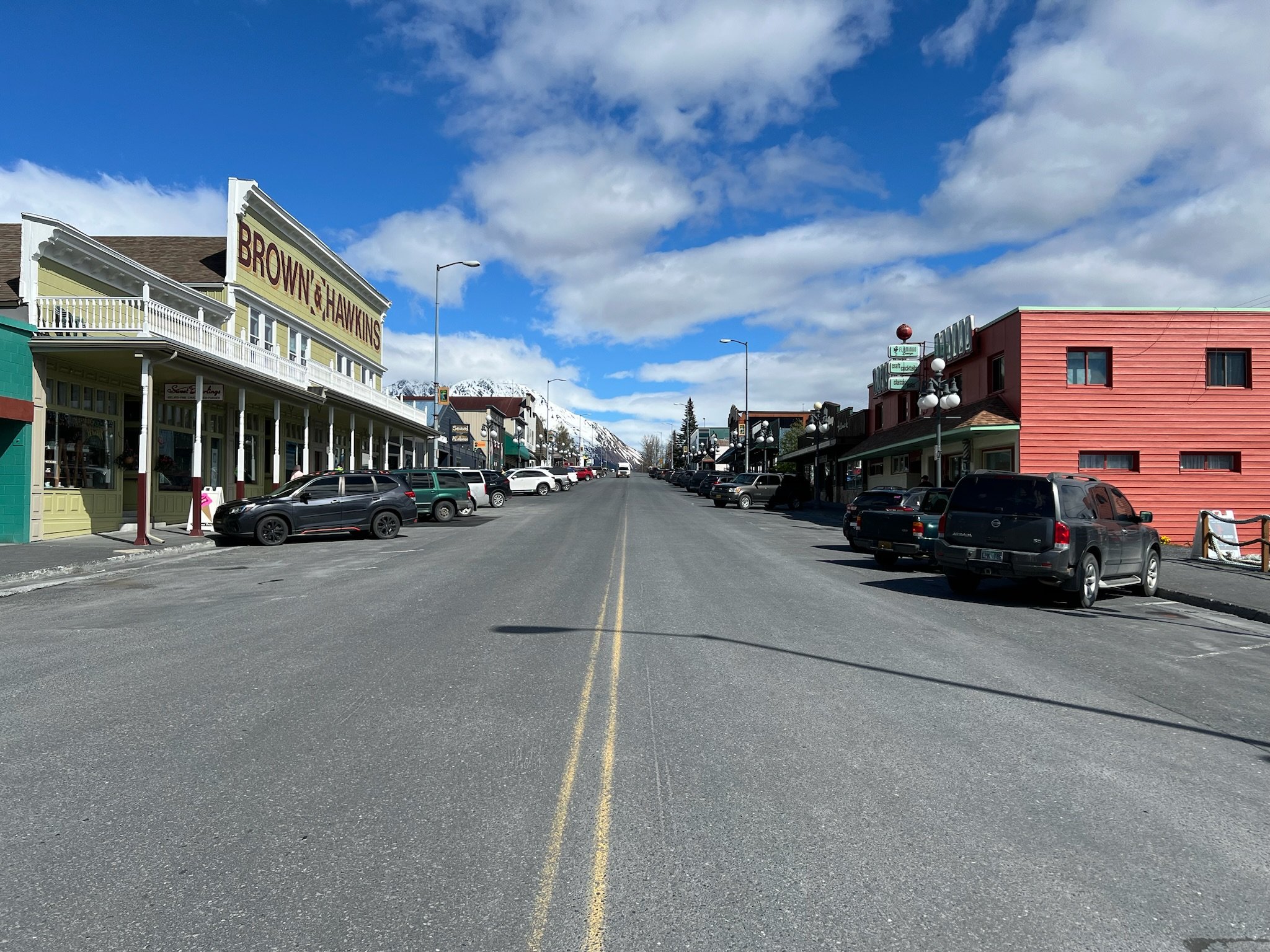 Historic downtown street with Brown Hawks building and mountains