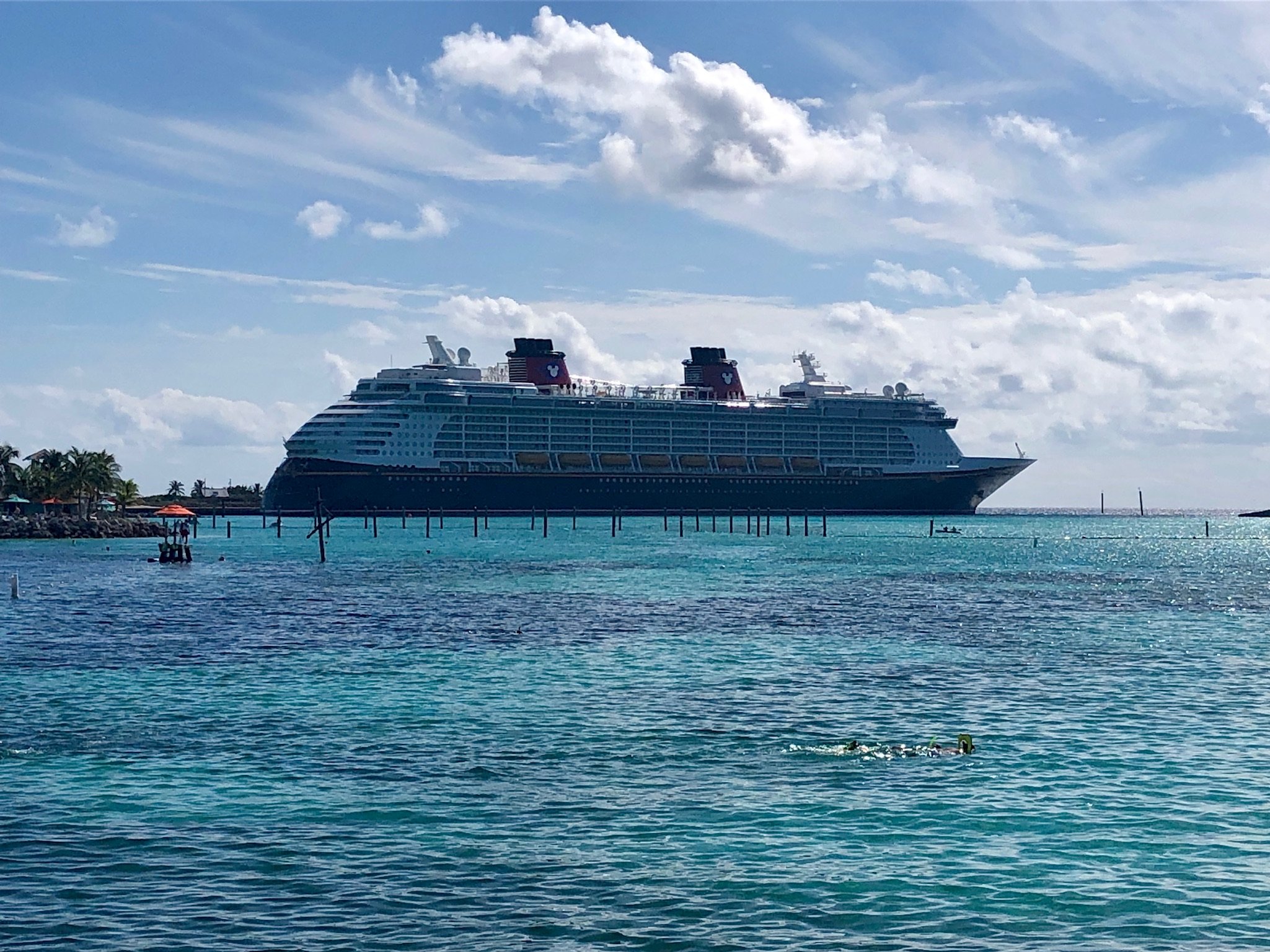 Large cruise ship anchored in turquoise tropical waters