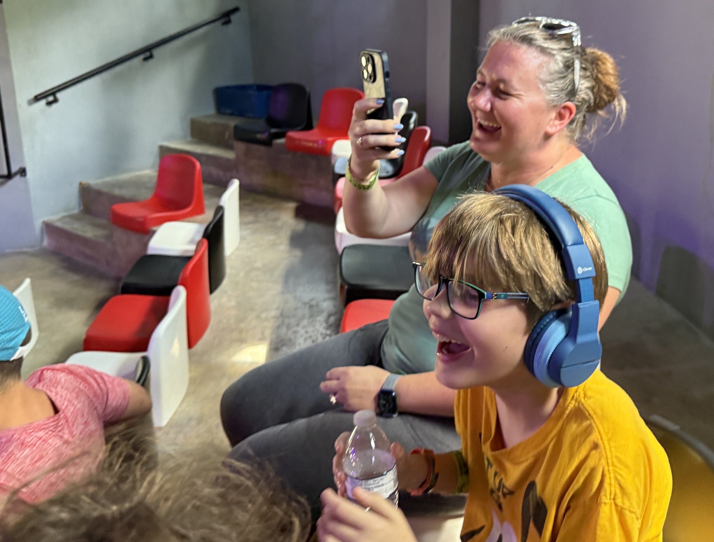 Woman and child enjoying gaming arcade on cruise ship