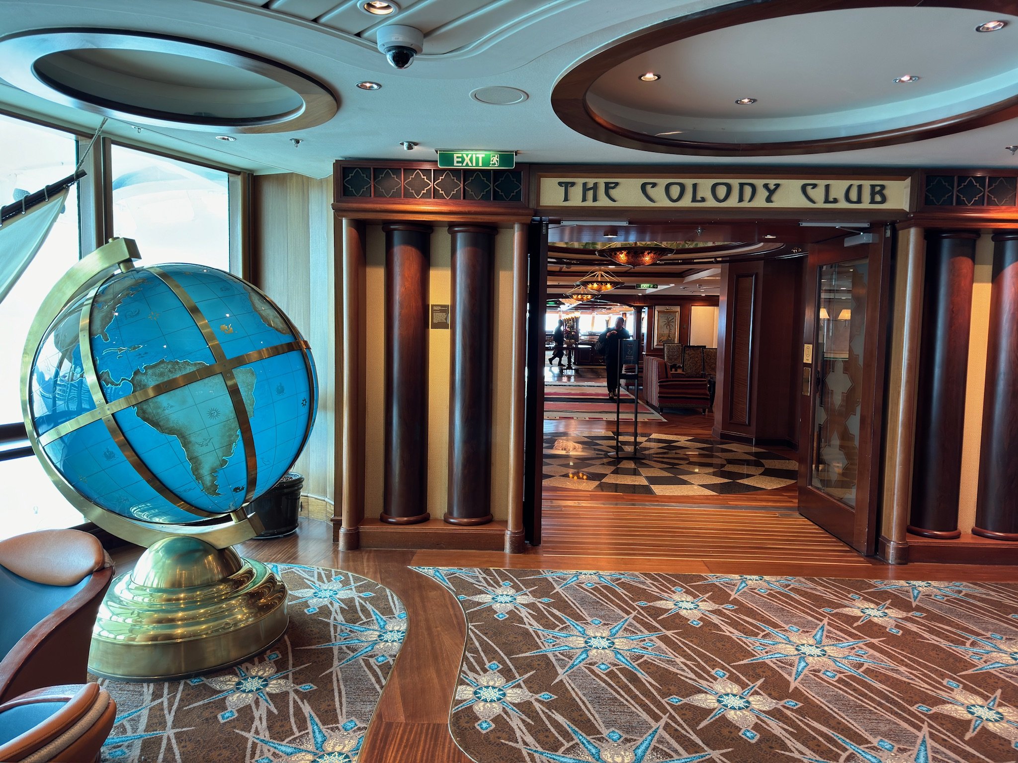 The Colody Club entrance on cruise ship with globe decor