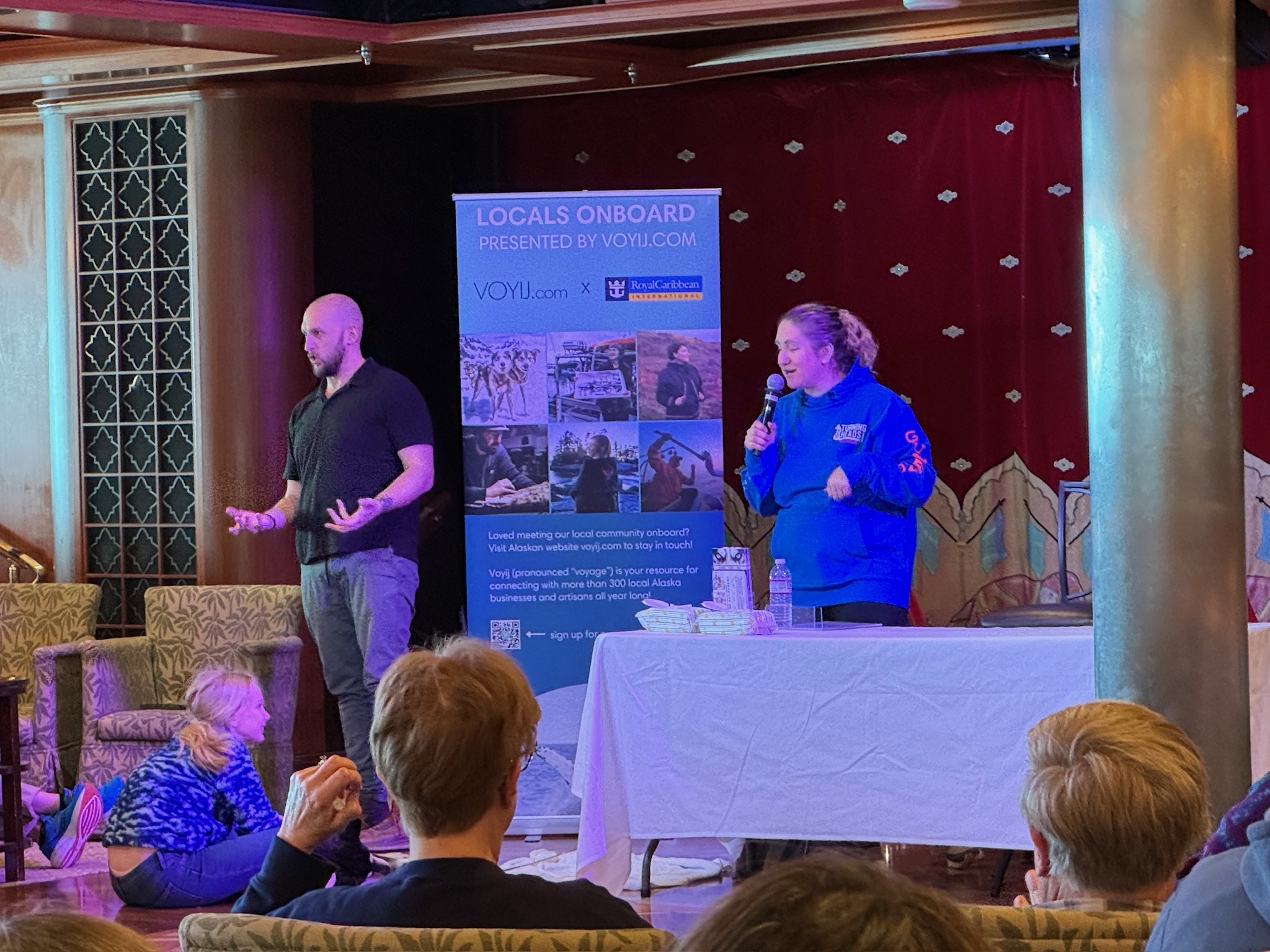 Two speakers present Locals Onboard program on cruise ship stage