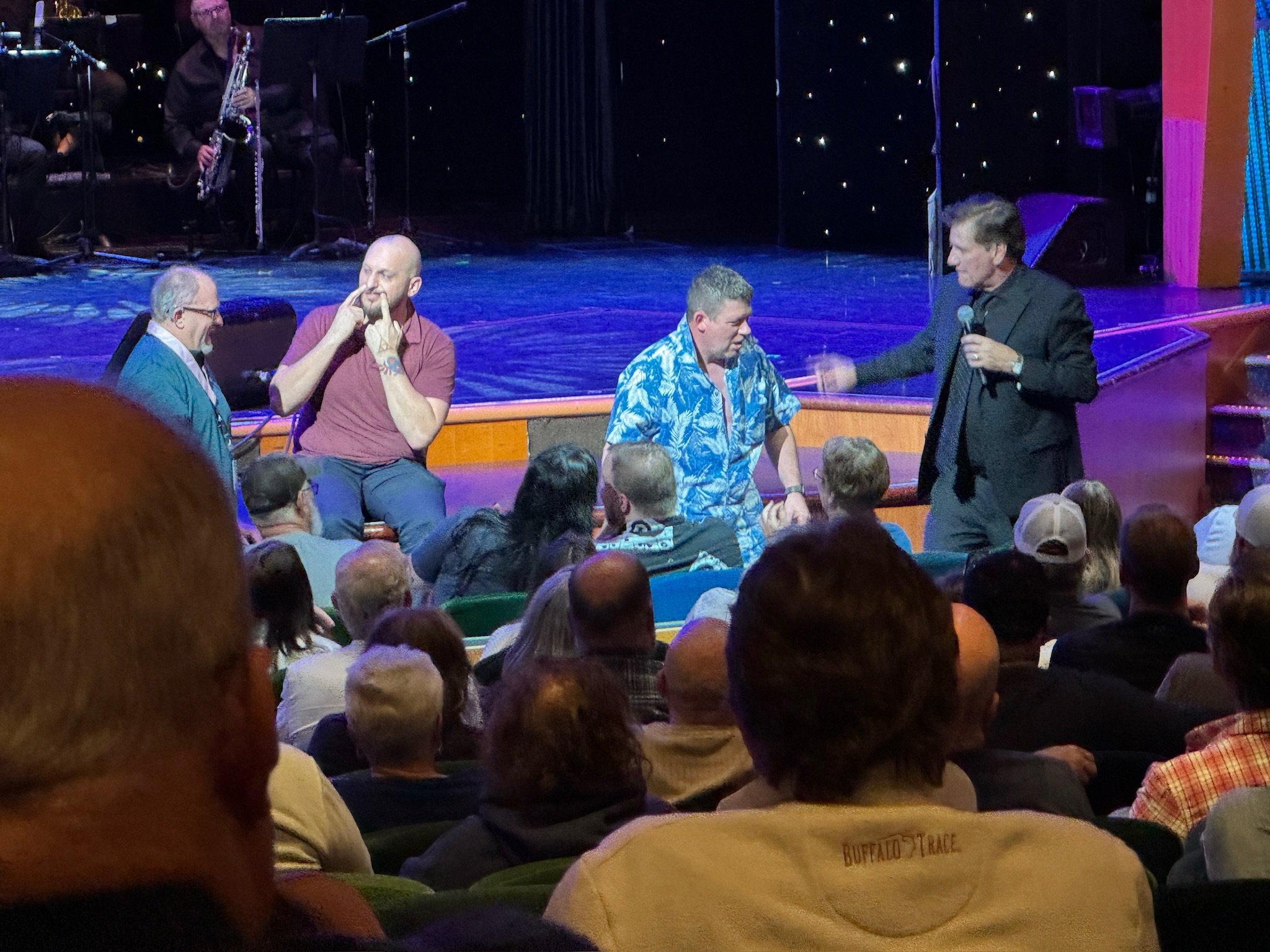 Live comedy show performance on cruise ship stage