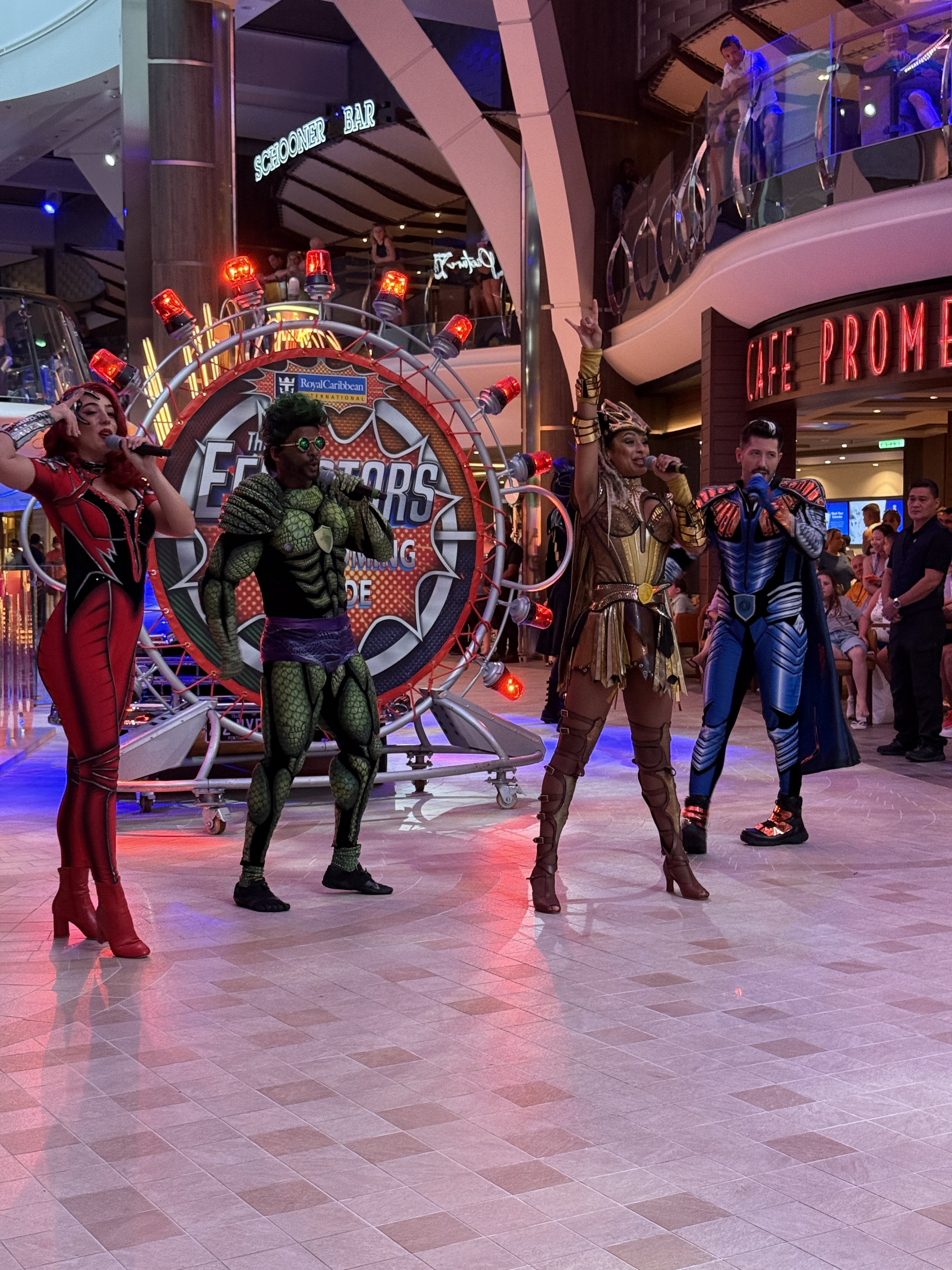 Costumed performers entertain guests at Royal Caribbean cruise ship promenade