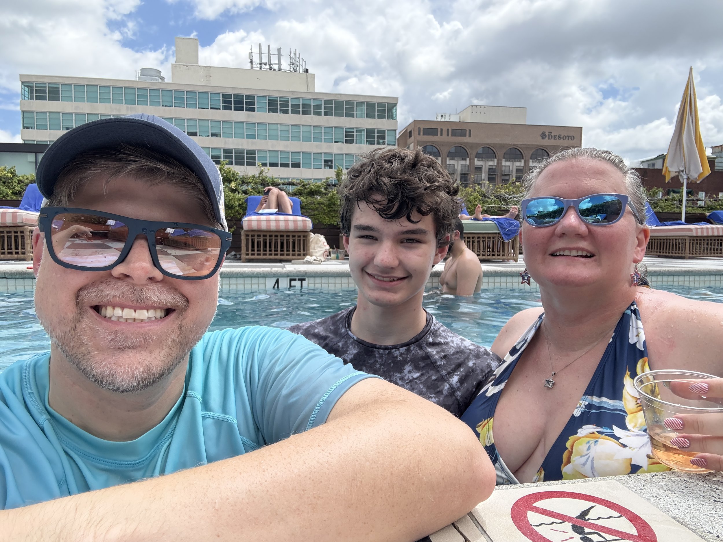 Family enjoying poolside drinks at cruise ship resort