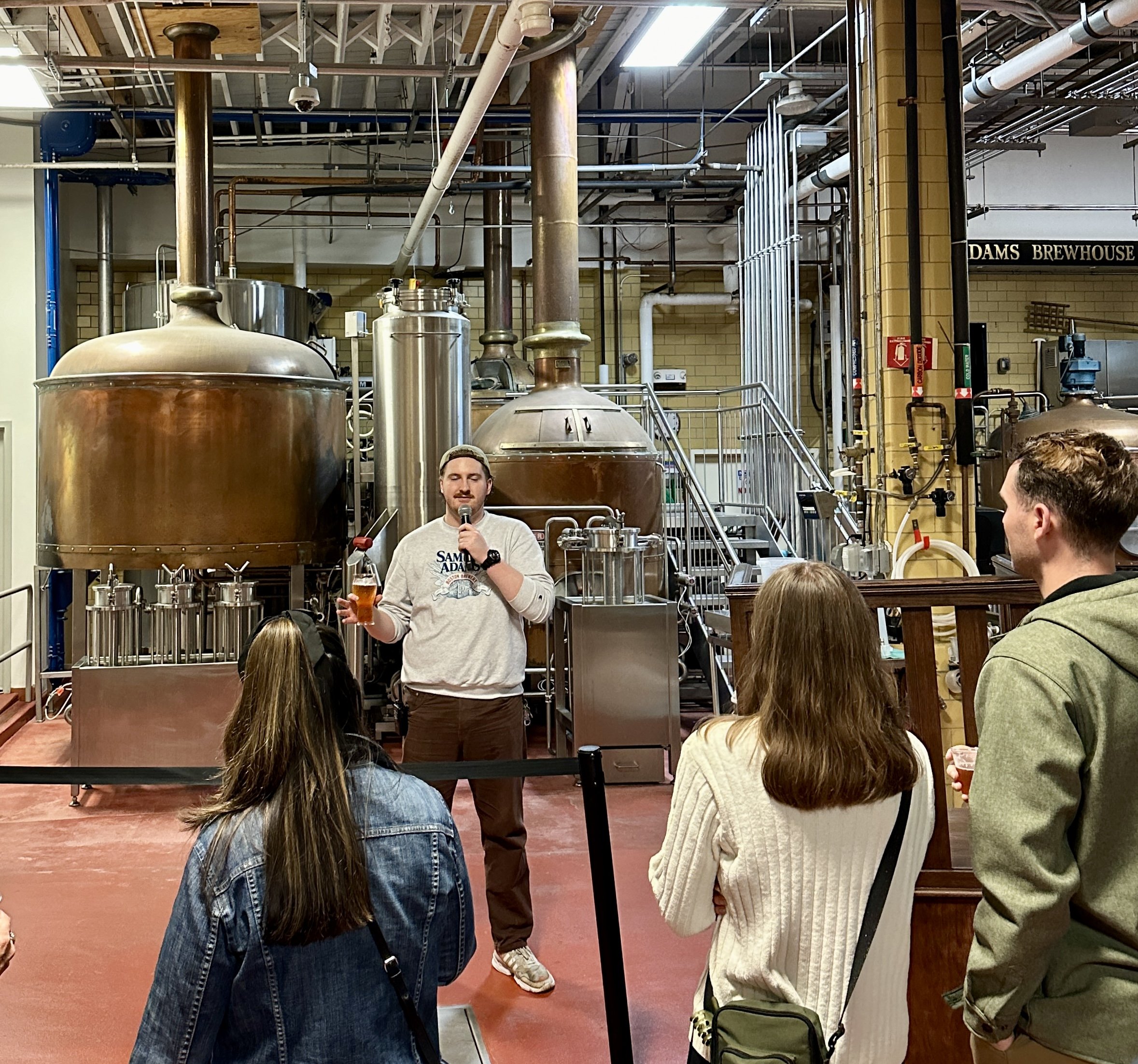 Man giving brewery tour at Adams Brewhouse facility