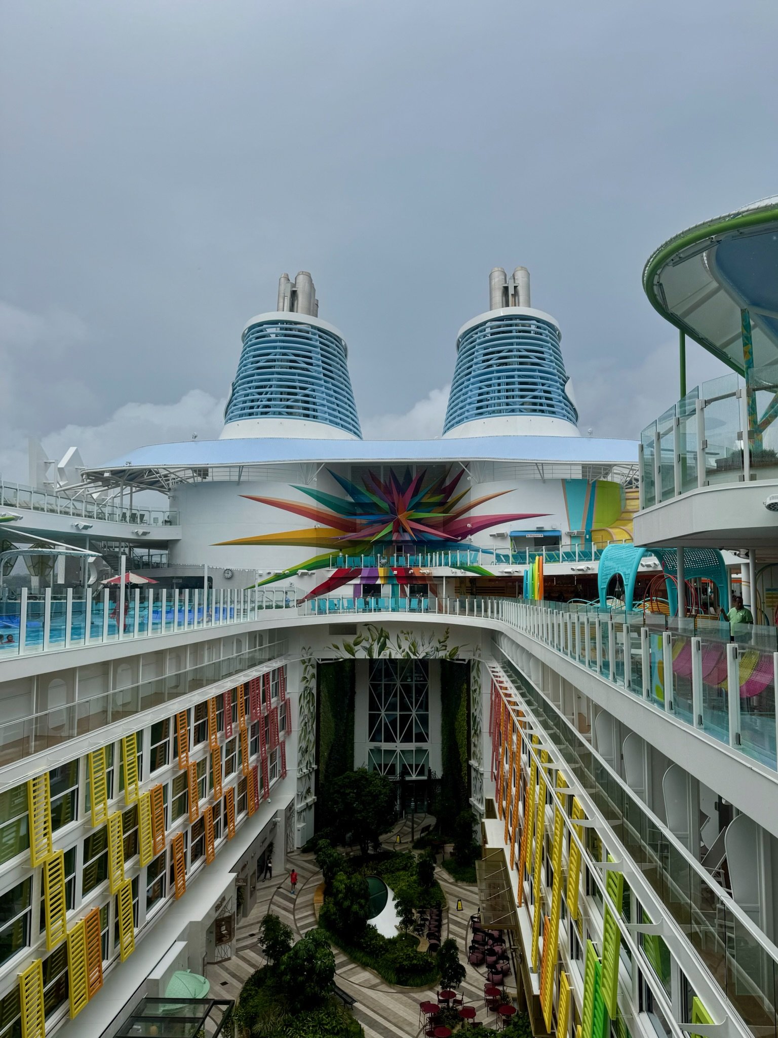 Symphony of the Seas colorful atrium and twin smokestacks
