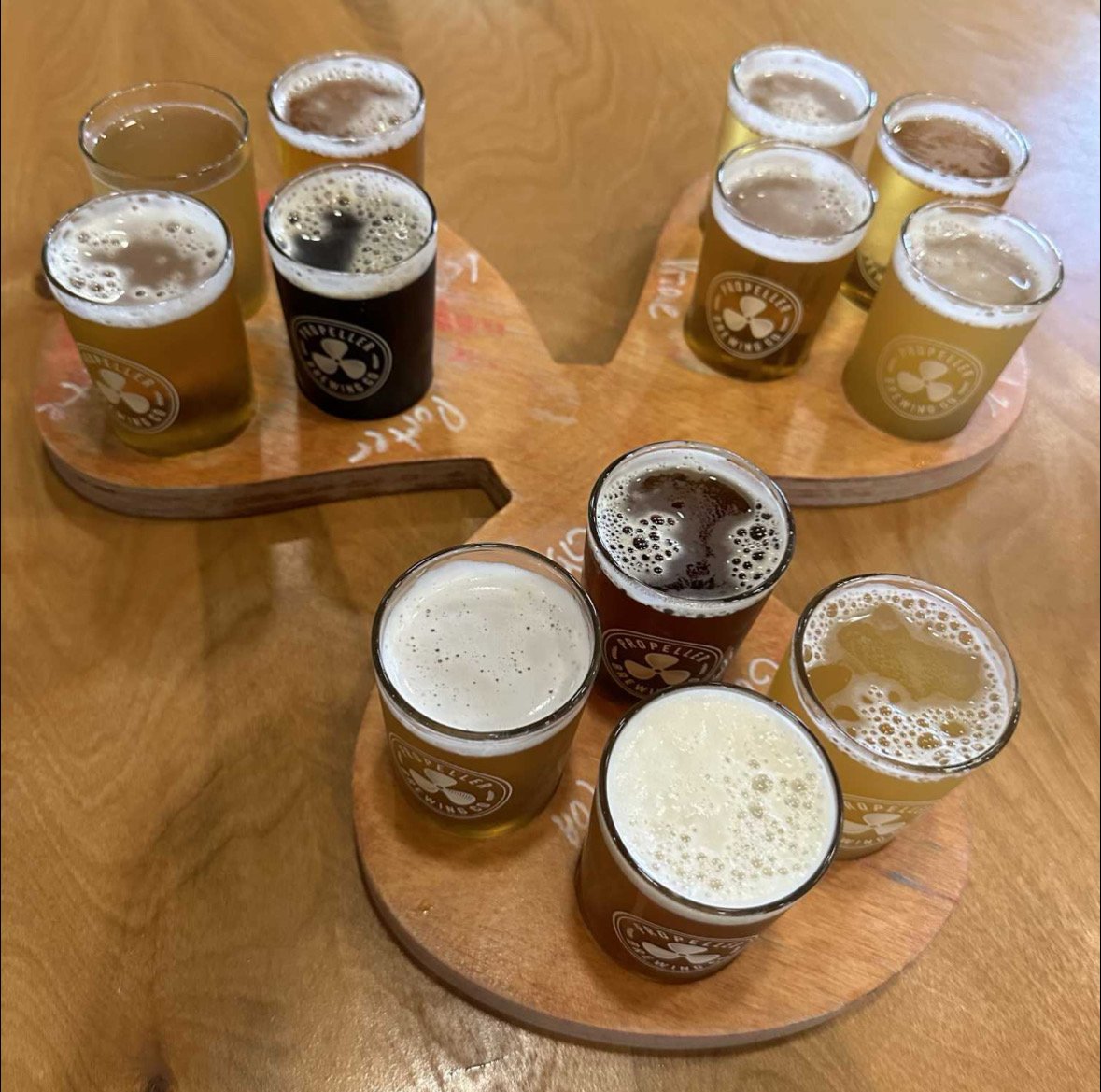 Beer flight tasting at craft brewery with pale ales and stouts