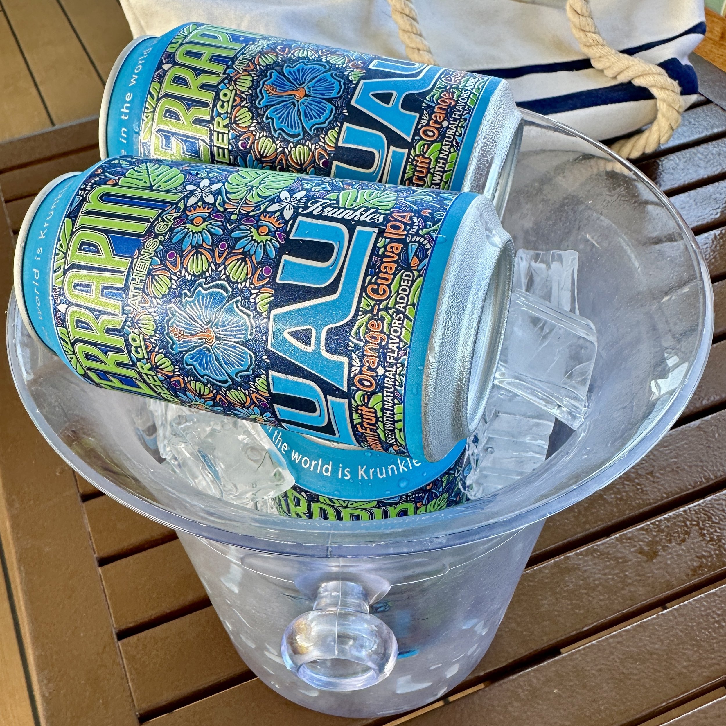 Krunkle beer cans in clear cruise ship bucket with ice