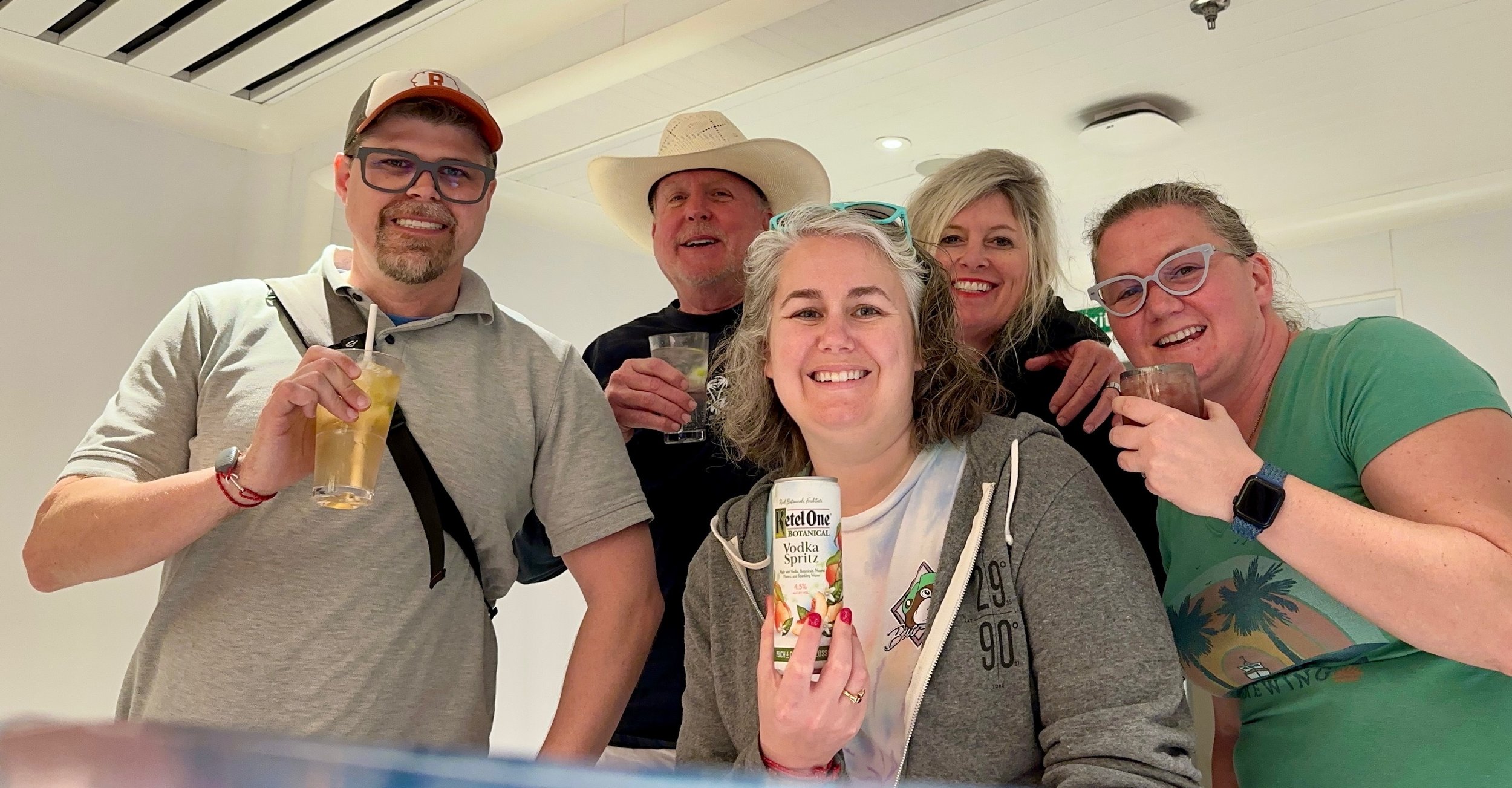 Group of five friends enjoying cocktails and Ketel One Vodka Sprite on cruise ship