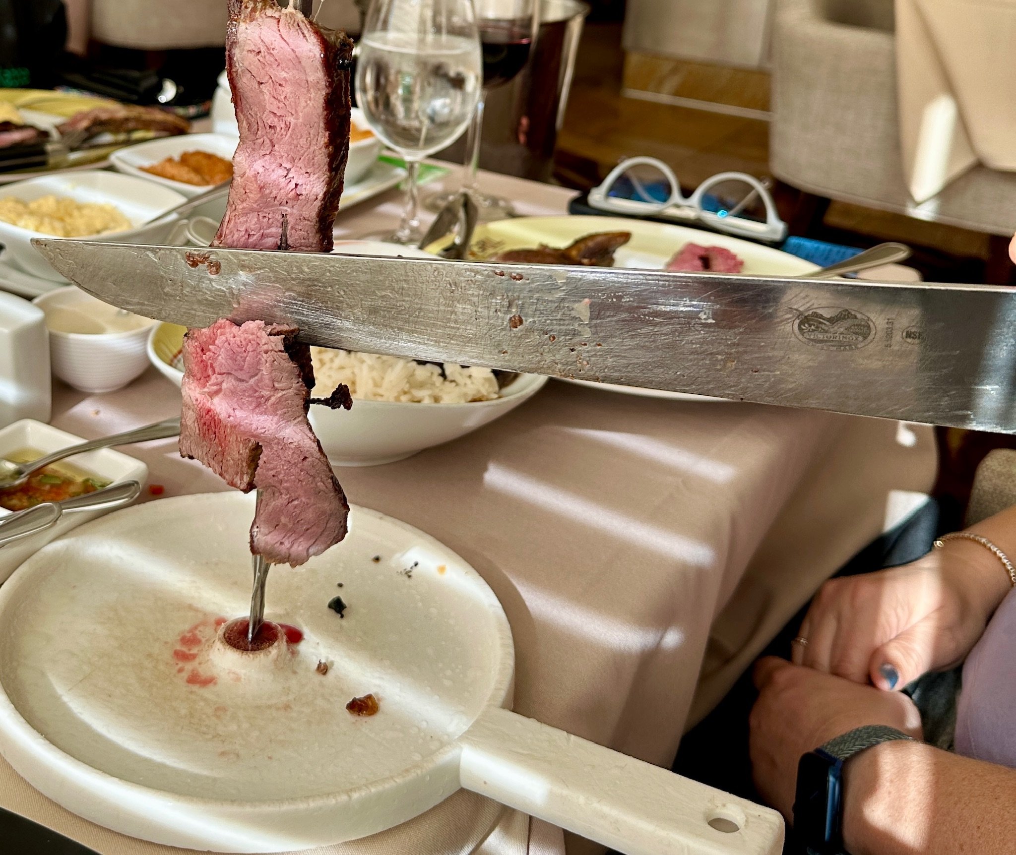 Carving roasted beef at formal dining dinner service