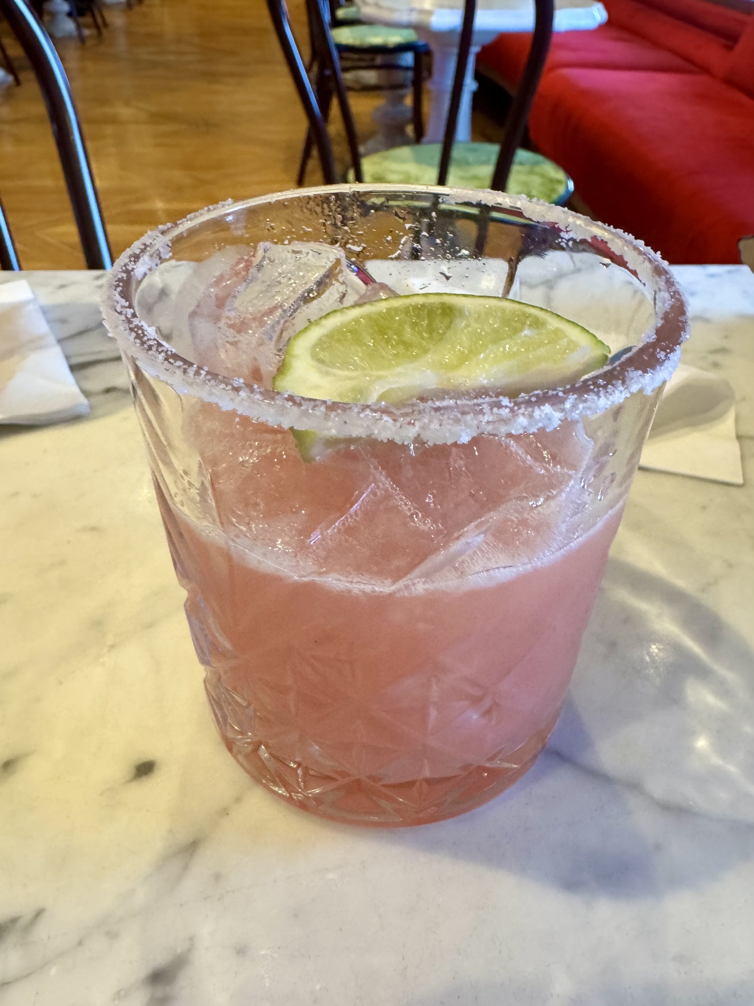Margarita cocktail with salted rim and lime garnish