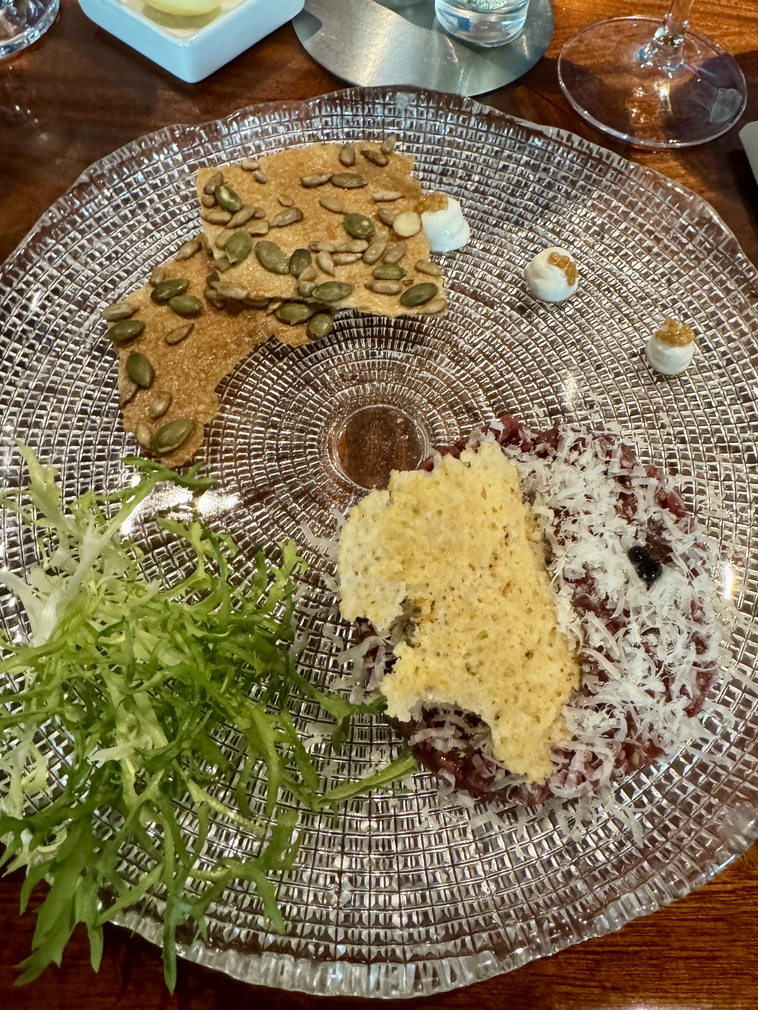 # Gourmet plated appetizer with pâté, cured meats, pumpkin seeds