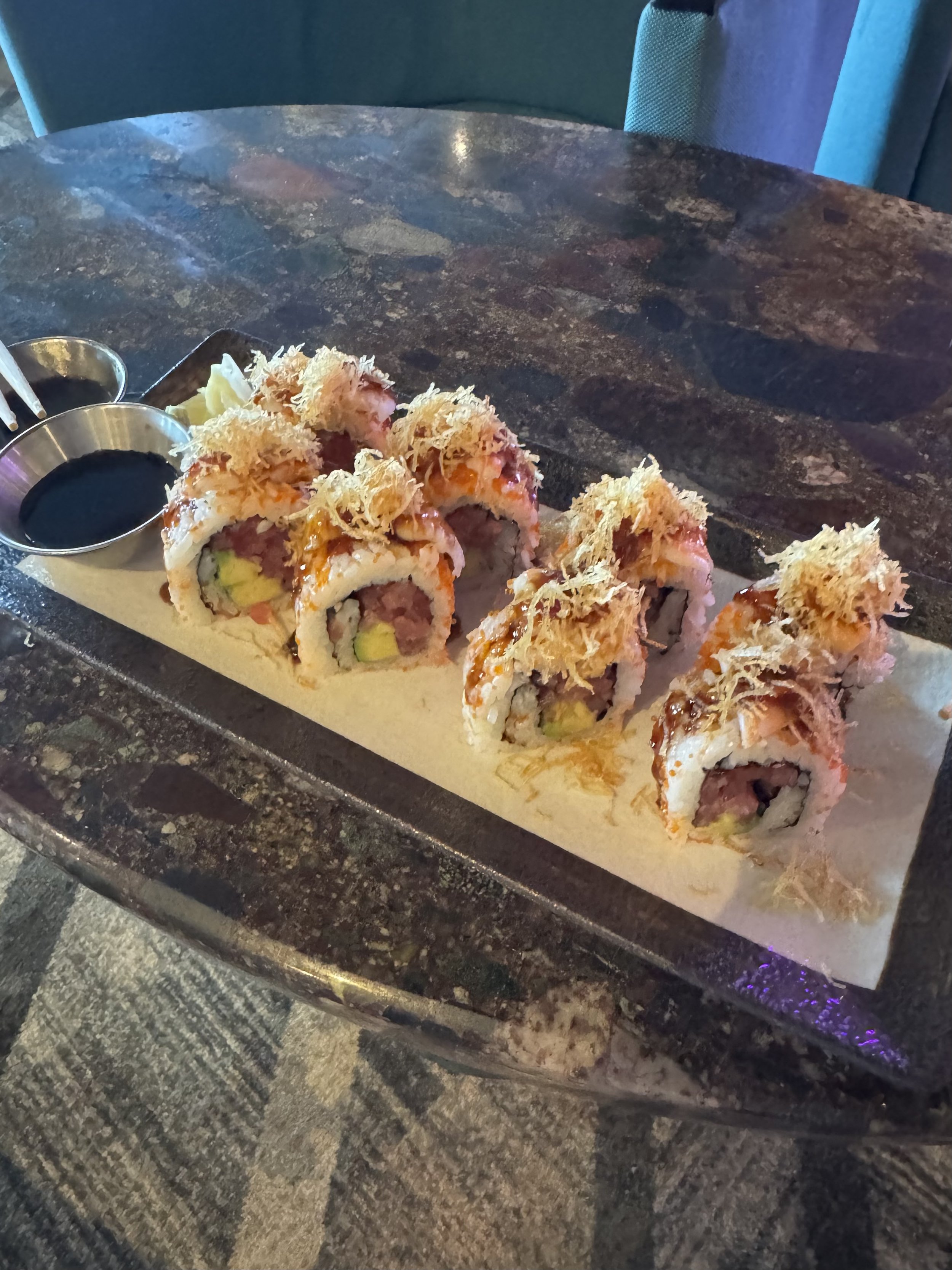 Tempura sushi rolls with crispy topping served on plate