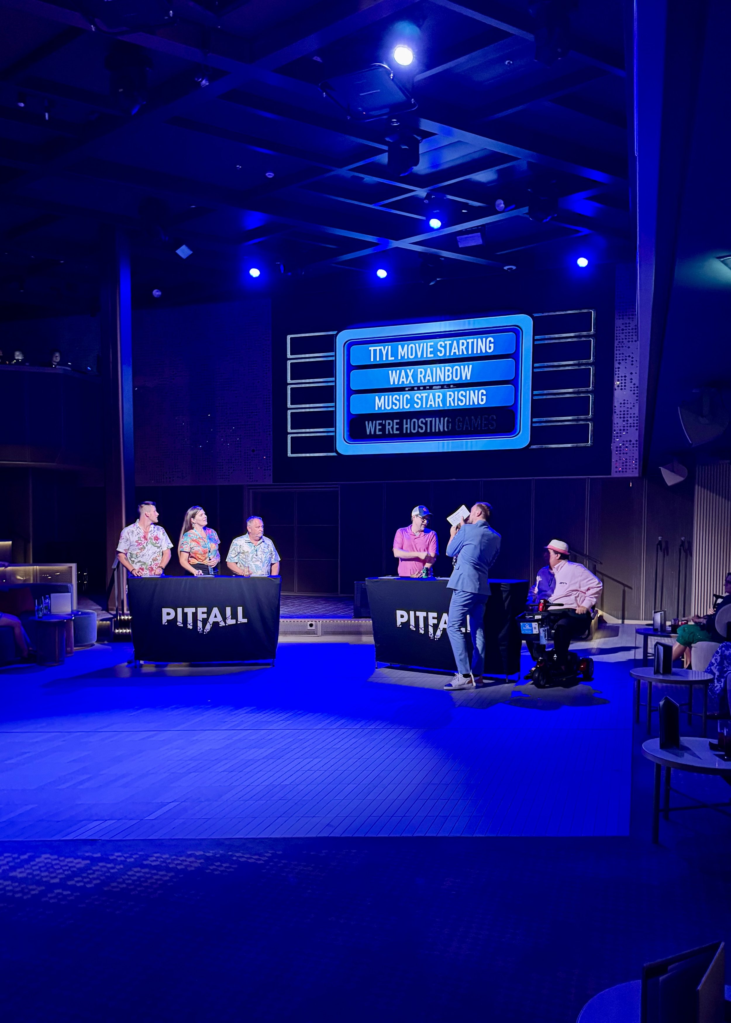 Pitfall game show panel discussion on cruise ship stage