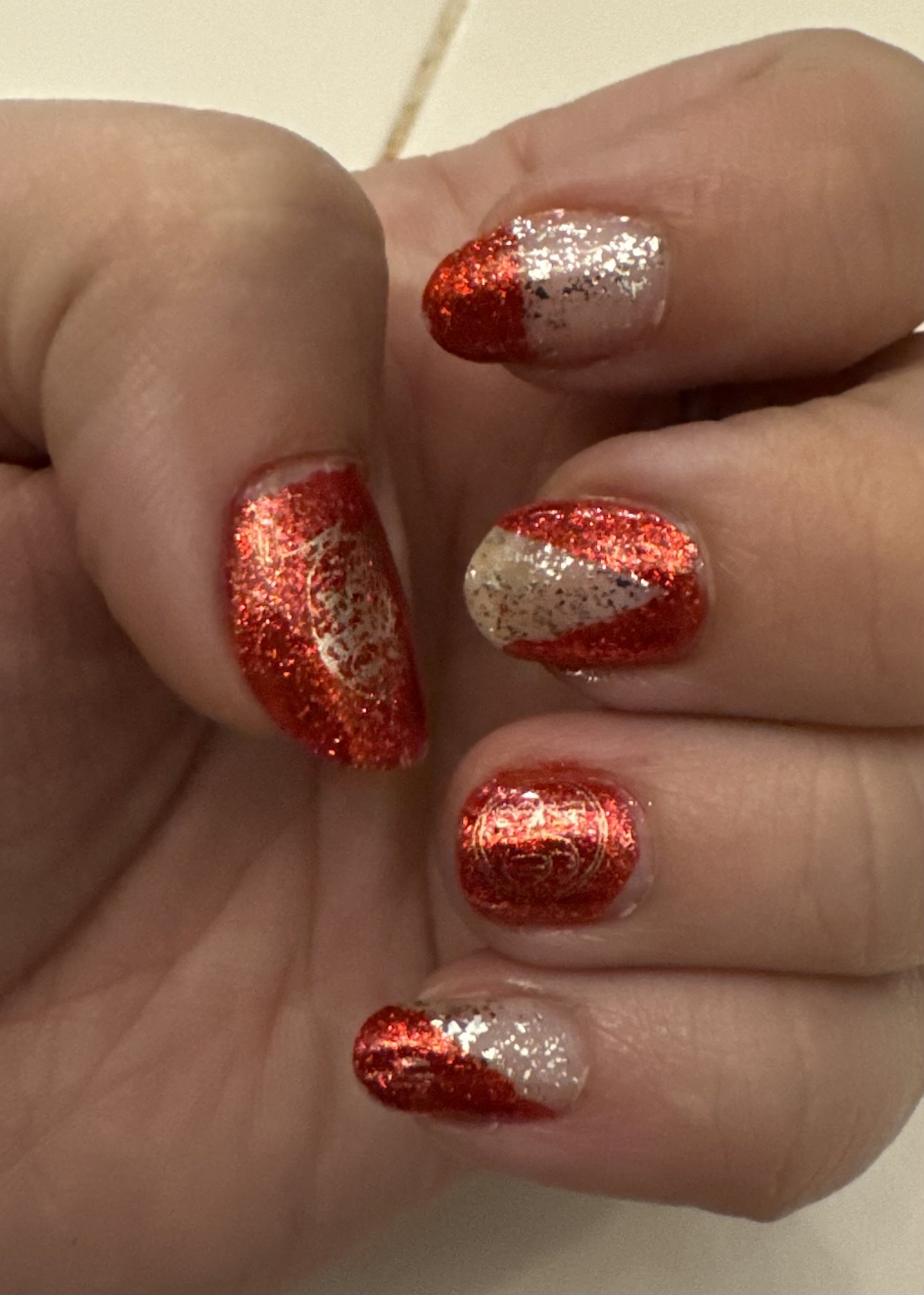 Festive red and silver glitter nail art manicure design