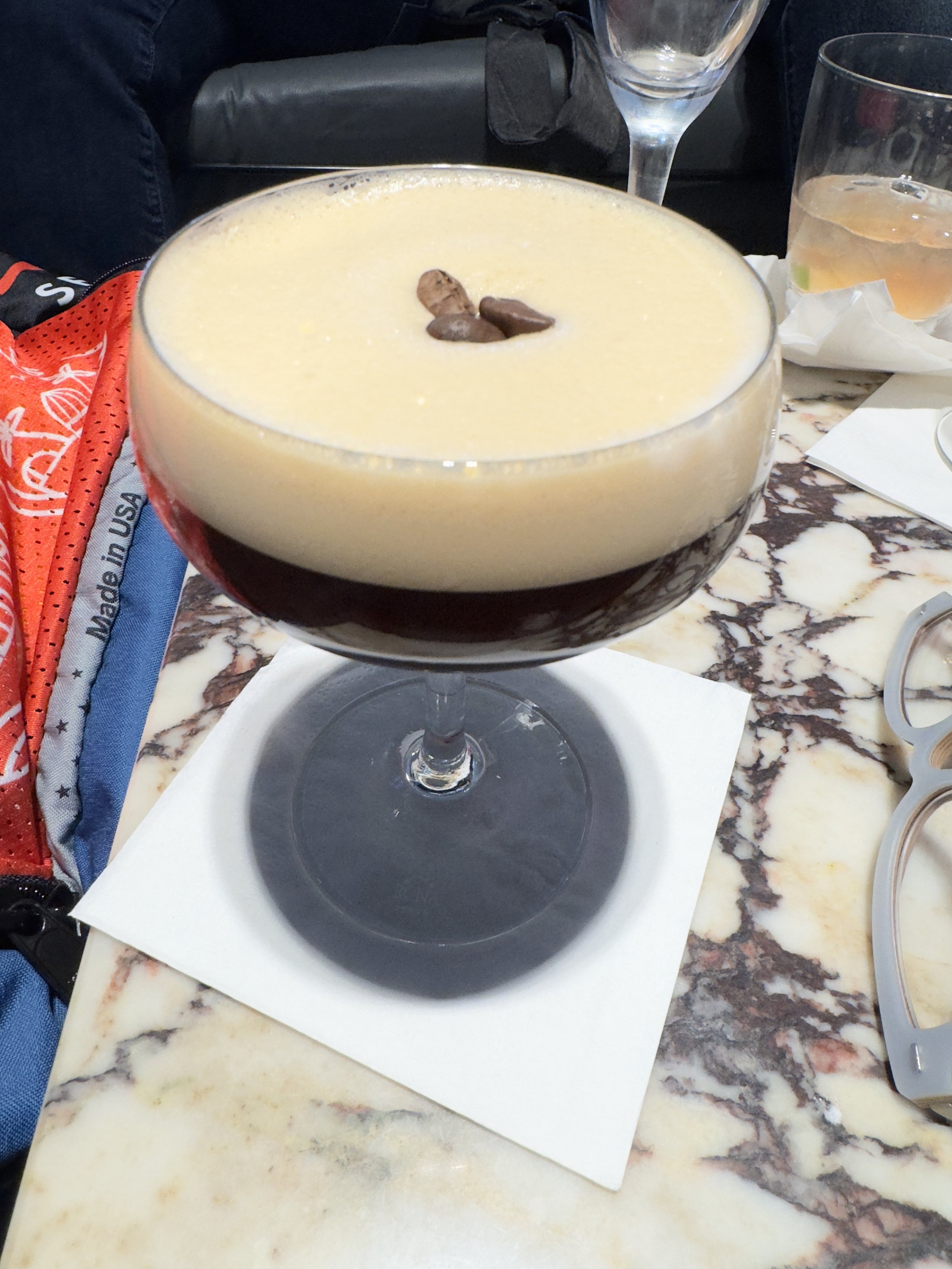Creamy dessert with chocolate garnish in elegant coupe glass