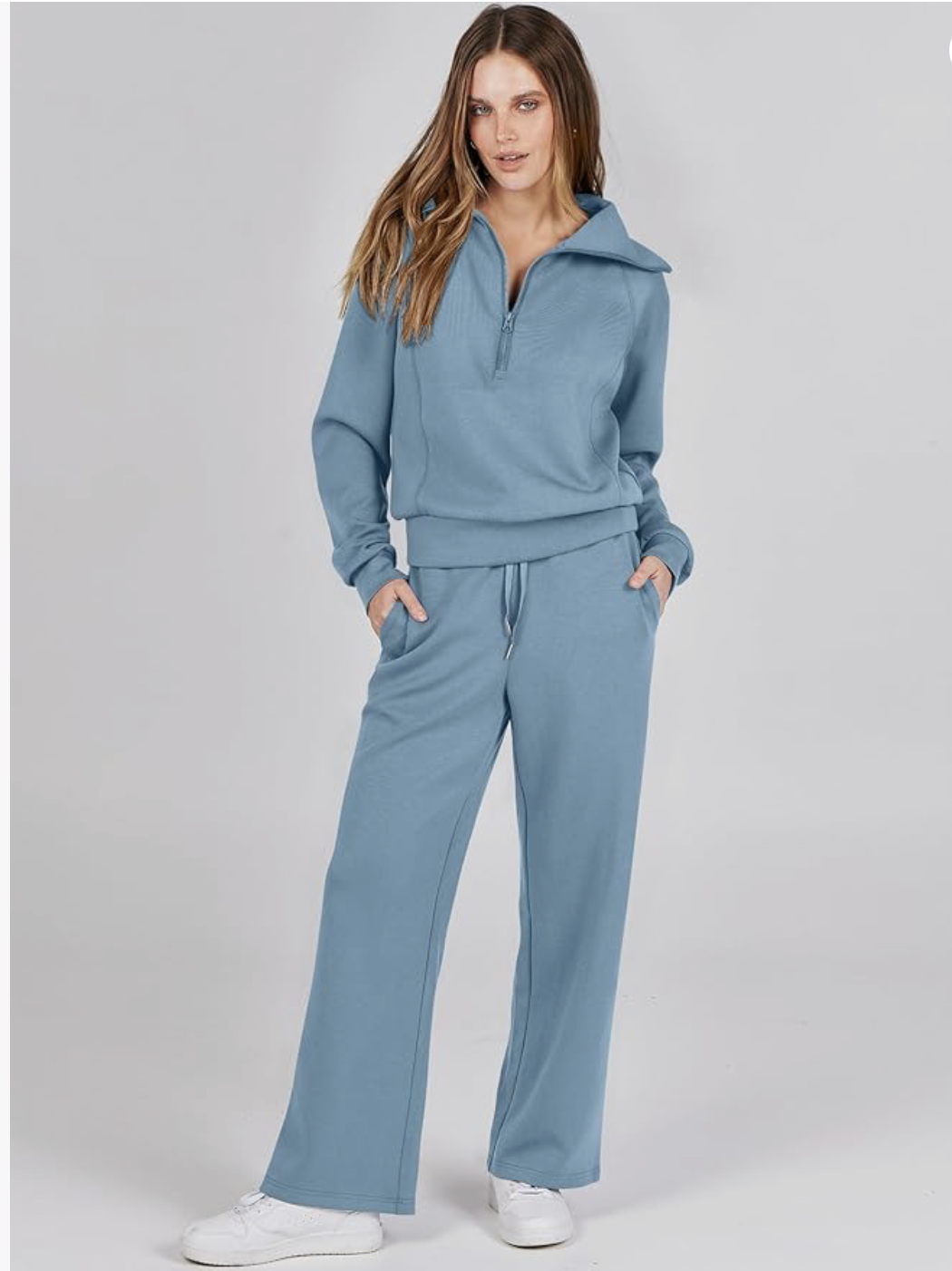 Woman wearing blue athleisure tracksuit with white sneakers