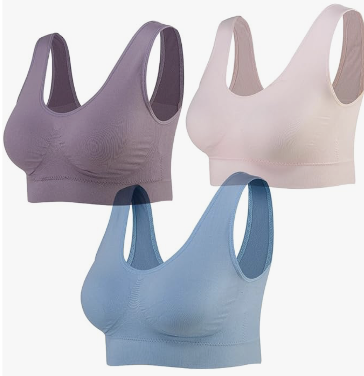 I can see this image shows three sports bras in different colors (purple, beige, and blue), but this appears to be a product display rather than a cruise travel blog image. 

If you'd like alt text for this as a product image, here's an appropriate description:

Three seamless sports bras displayed in purple beige and blue colors

However, if this was