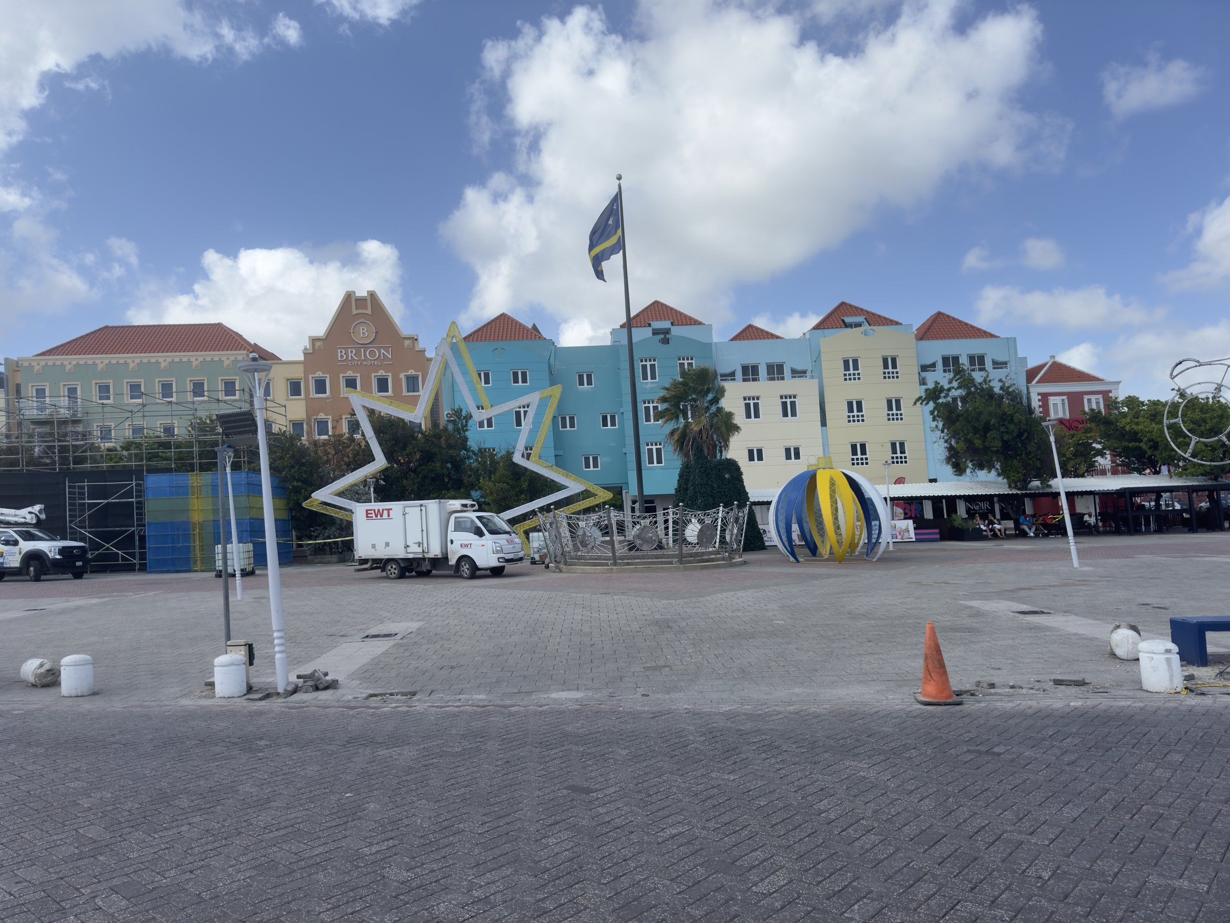 Colorful Caribbean waterfront buildings with blue and yellow star decorations